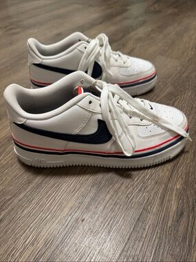 Nike Air Force 1s LV8 White Sneakers with Navy Swoosh and Red Trim